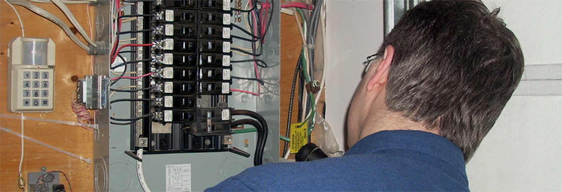 Technician checking a Fuse Panel